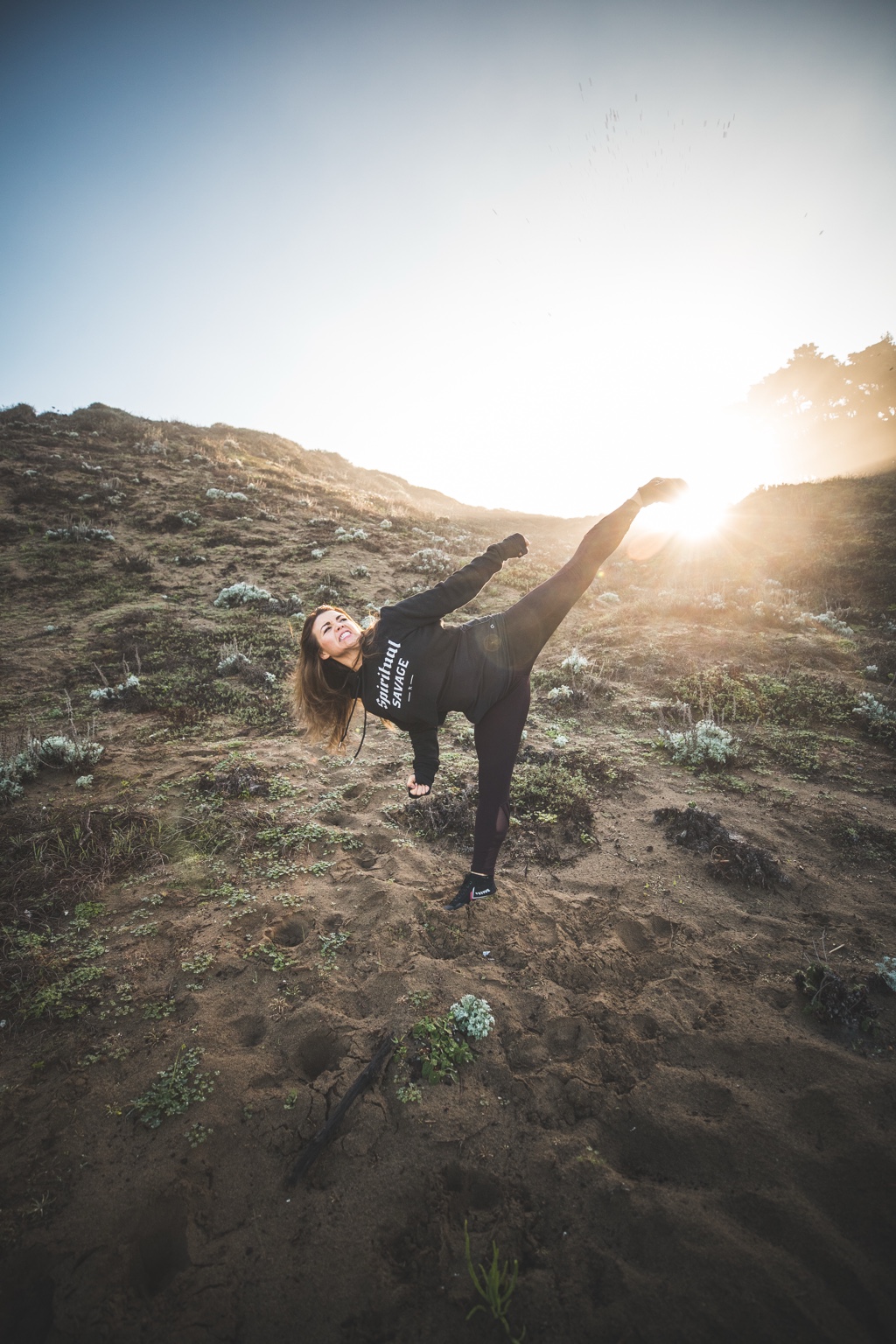 Ka’imi Kuoha executing a high kick outdoors